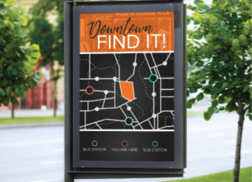 Outdoor map display of a downtown area and "you are here" marked