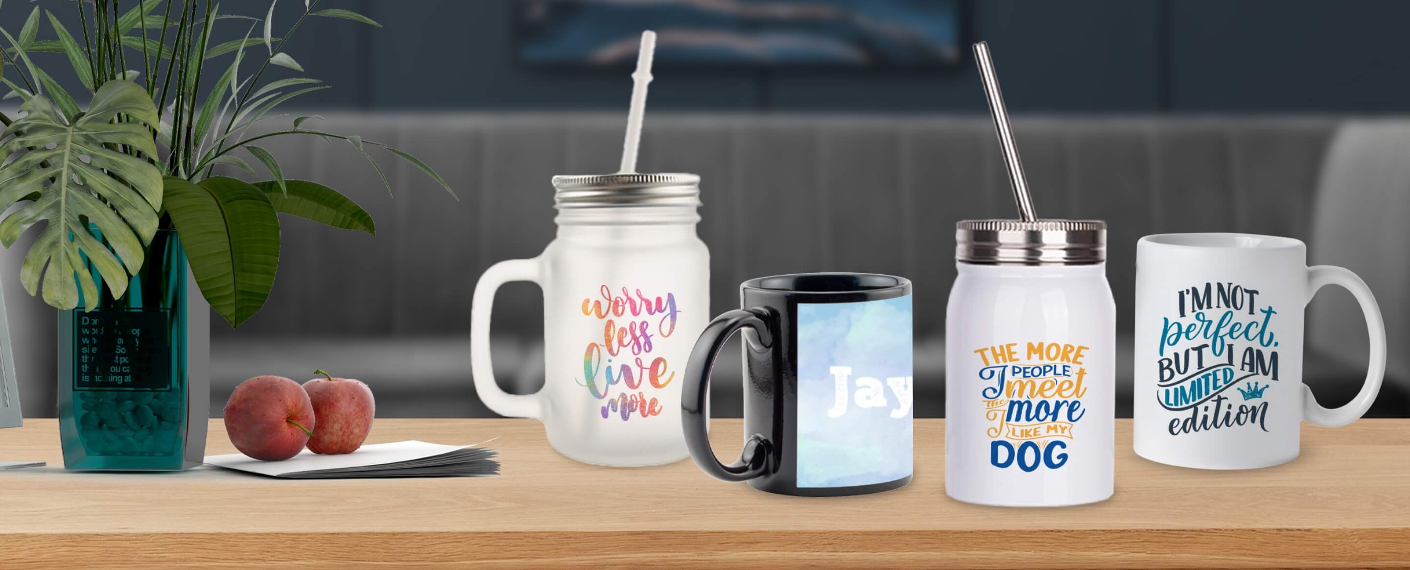 four different customized drinkware items sitting on a table