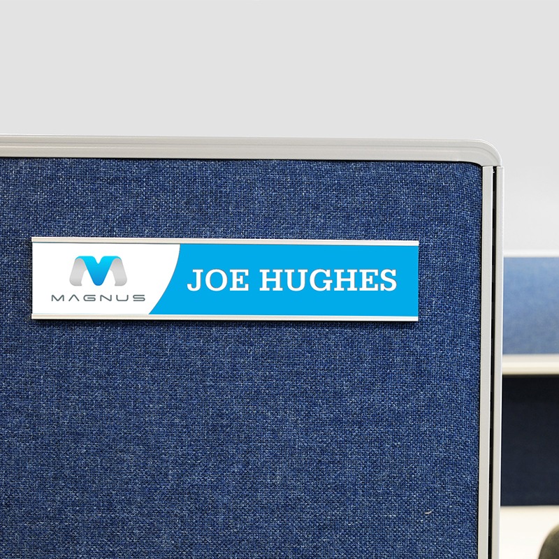 customized nameplate displayed in a nameplate holder on a cubicle wall