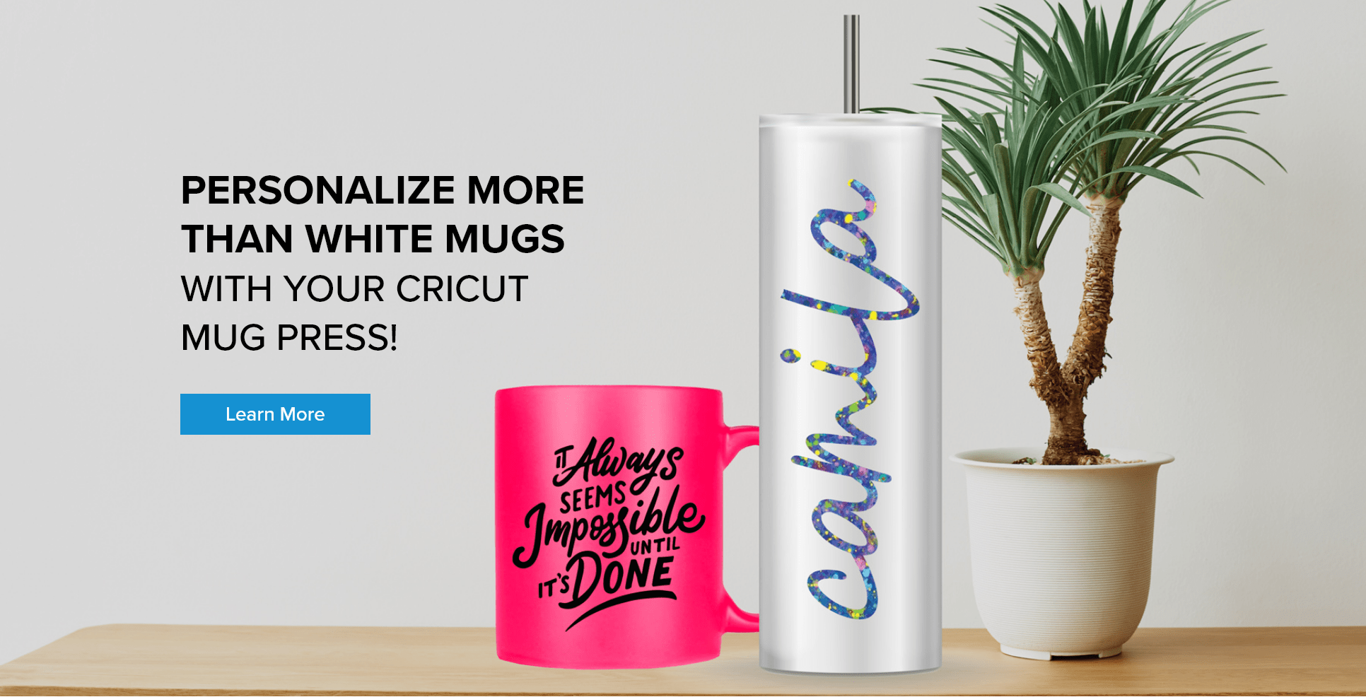Personalized tumbler and mug next to a plant with a Learn More button