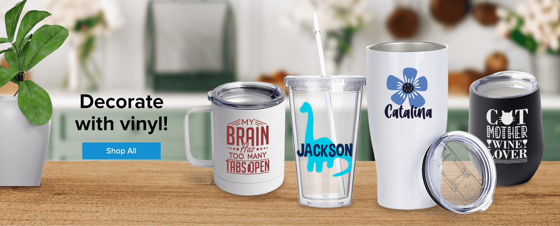 four different customized drinkware items sitting on a table